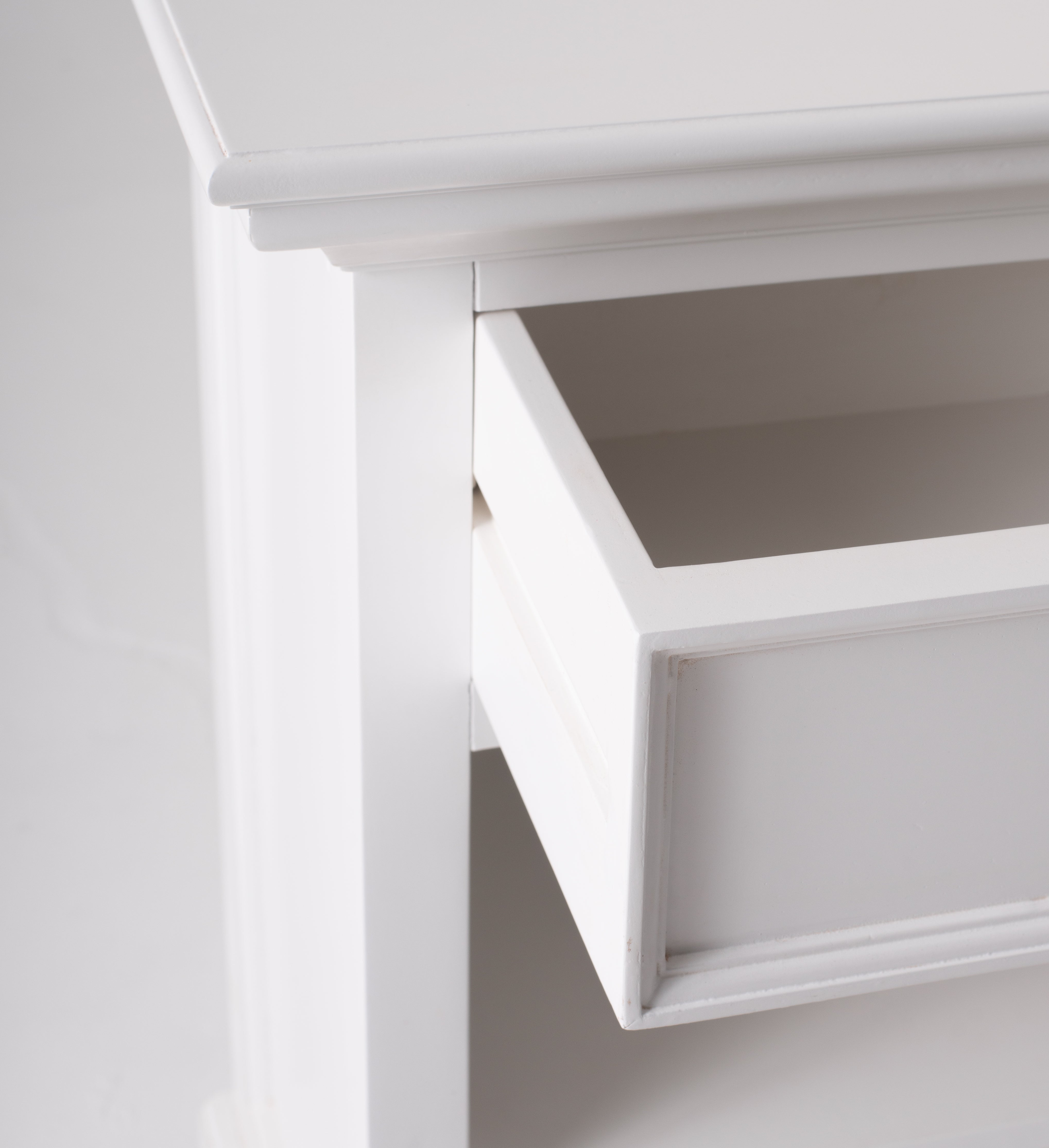 Close-up of the open drawer on the Halifax Grand Bedside Table showing the white painted finish and moulded edge detail.