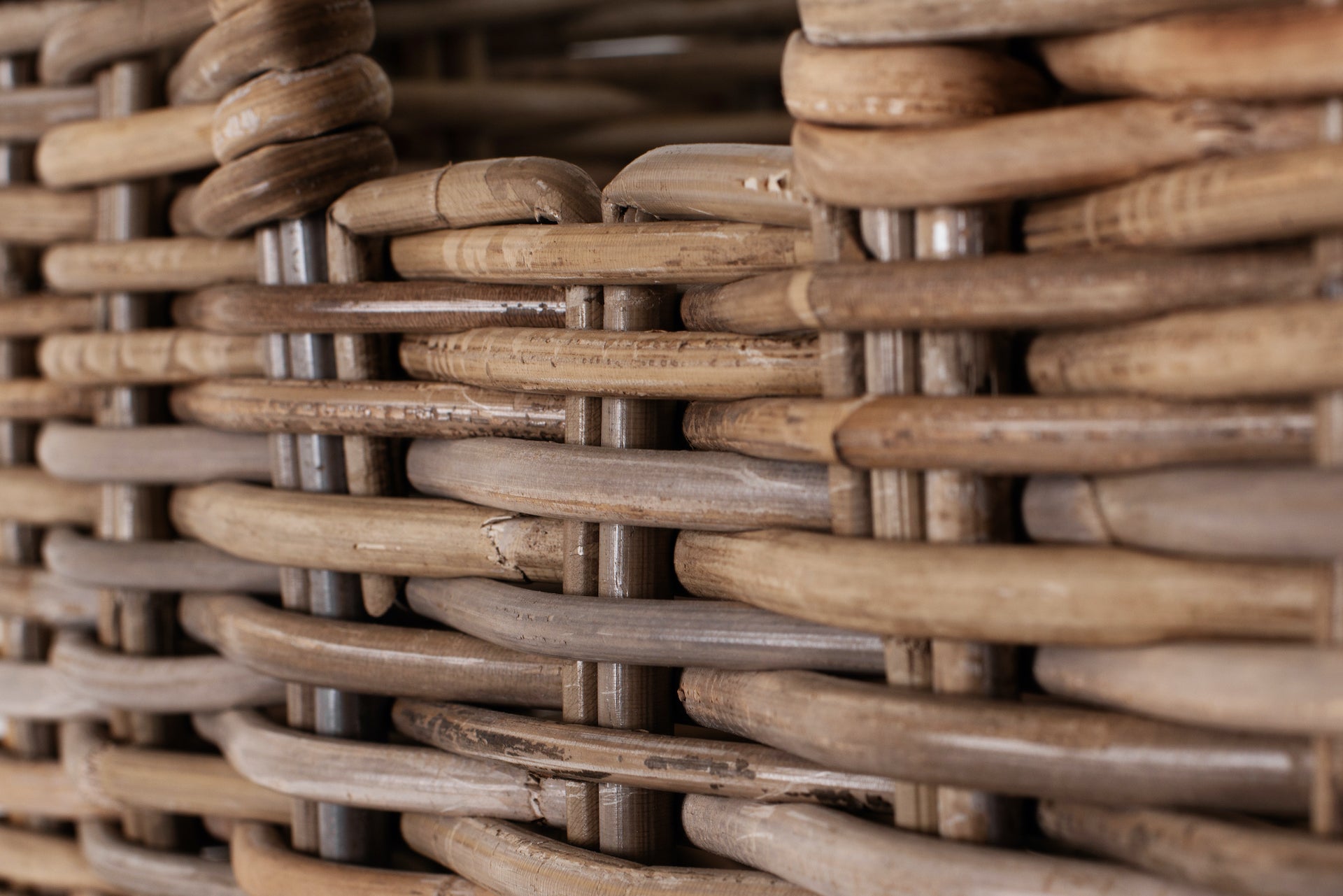 Close-up detail of the woven basket texture from the Halifax Grand Storage Unit with Basket Set.
