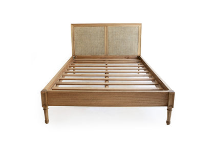 Hamilton Cane Bed Weathered Oak double bed front perspective showing full frame, woven cane headboard, slatted base, and elegant turned legs in a minimalist studio setting.