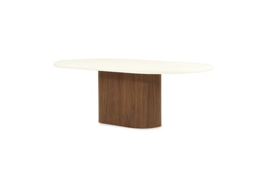 Angled front view of Harlow Oval Coffee Table - Walnut Base emphasising organic oval shape and minimalist design.
