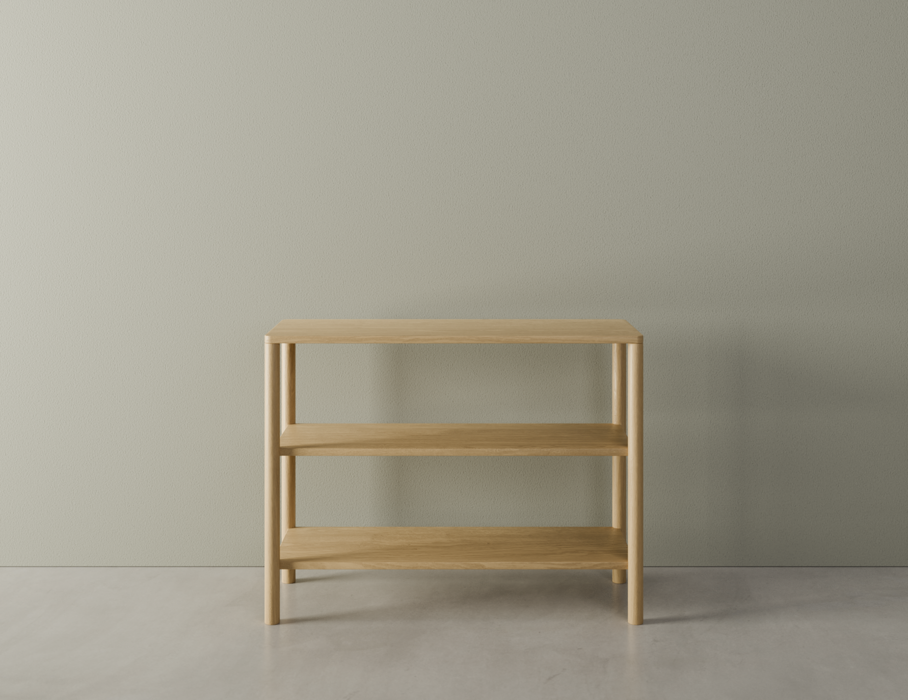 Front view of a 2 tier bookshelf made from American oak on a polished concrete floor.