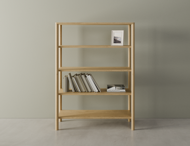 Wooden bookshelf with 4 shelves, 1 with books on it, in a natural American oak finish on a polished concrete floor.