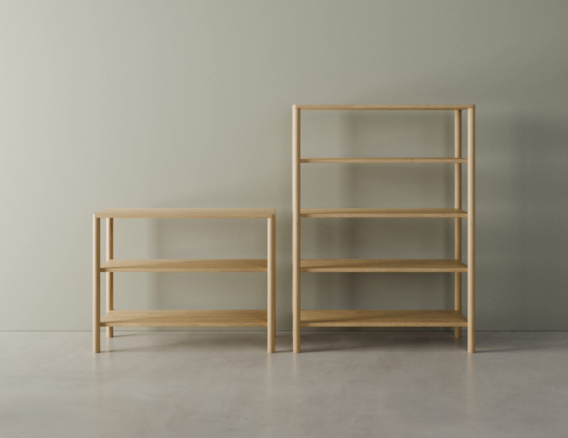 A 2 tier bookshelf next to a 4 tier bookshelf in a natural American oak finish on a polished concrete floor.
