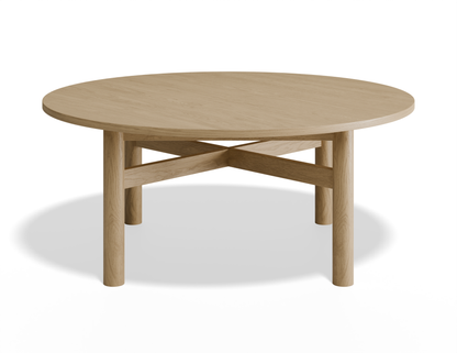 Slight aerial view of Nordica round wooden coffee table in natural oak finish