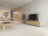 Nordica round wooden coffee table in a nordic lounge setting near a tv unit and dining setting.