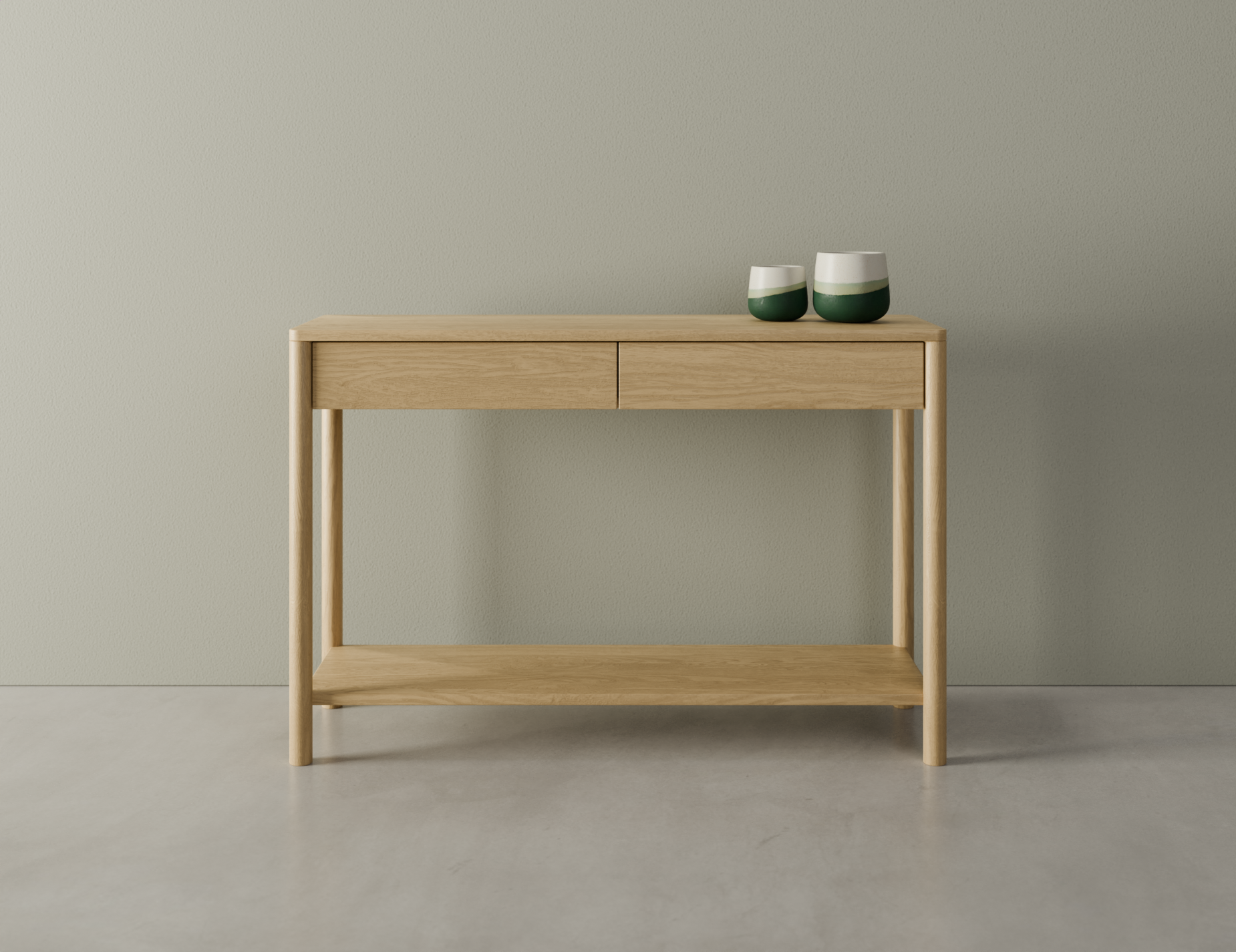 Nordica wooden console table in natural oak finish with 2 drawers displaying 2 ceramic ornaments on a polished concrete floor.