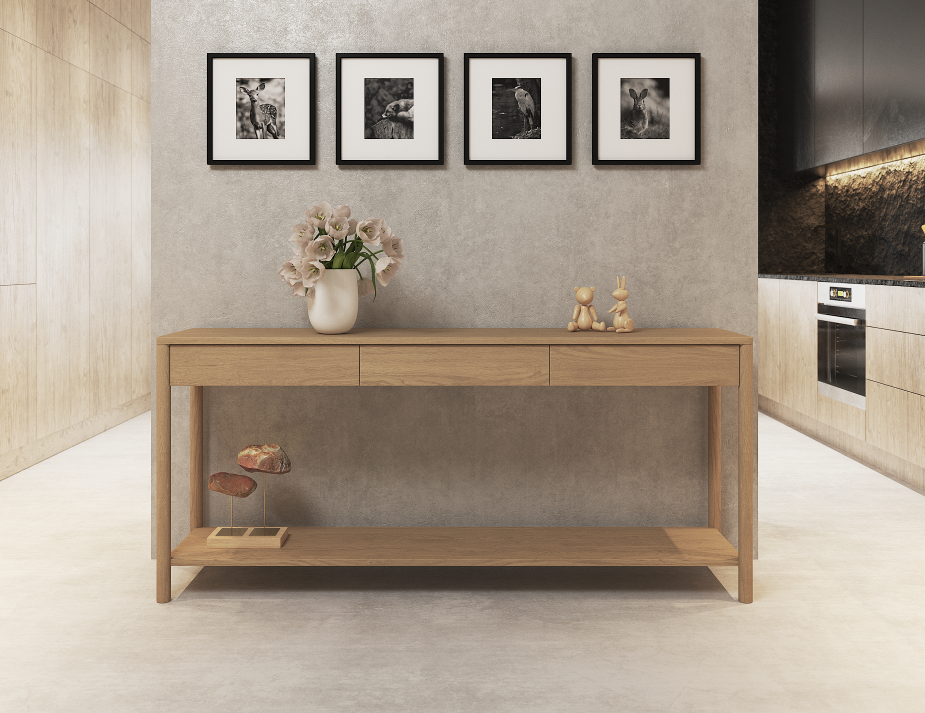 Nordica wooden console table in natural oak finish with 3 drawers against a concrete wall with 4 pictures hanging above in a modern house.