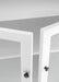 Close-up view of cabinet doors slightly open on traditional 3 level white timber pantry.