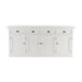 Front view of a white wooden buffet with 4 doors and 4 drawers with antique brass hardware.
