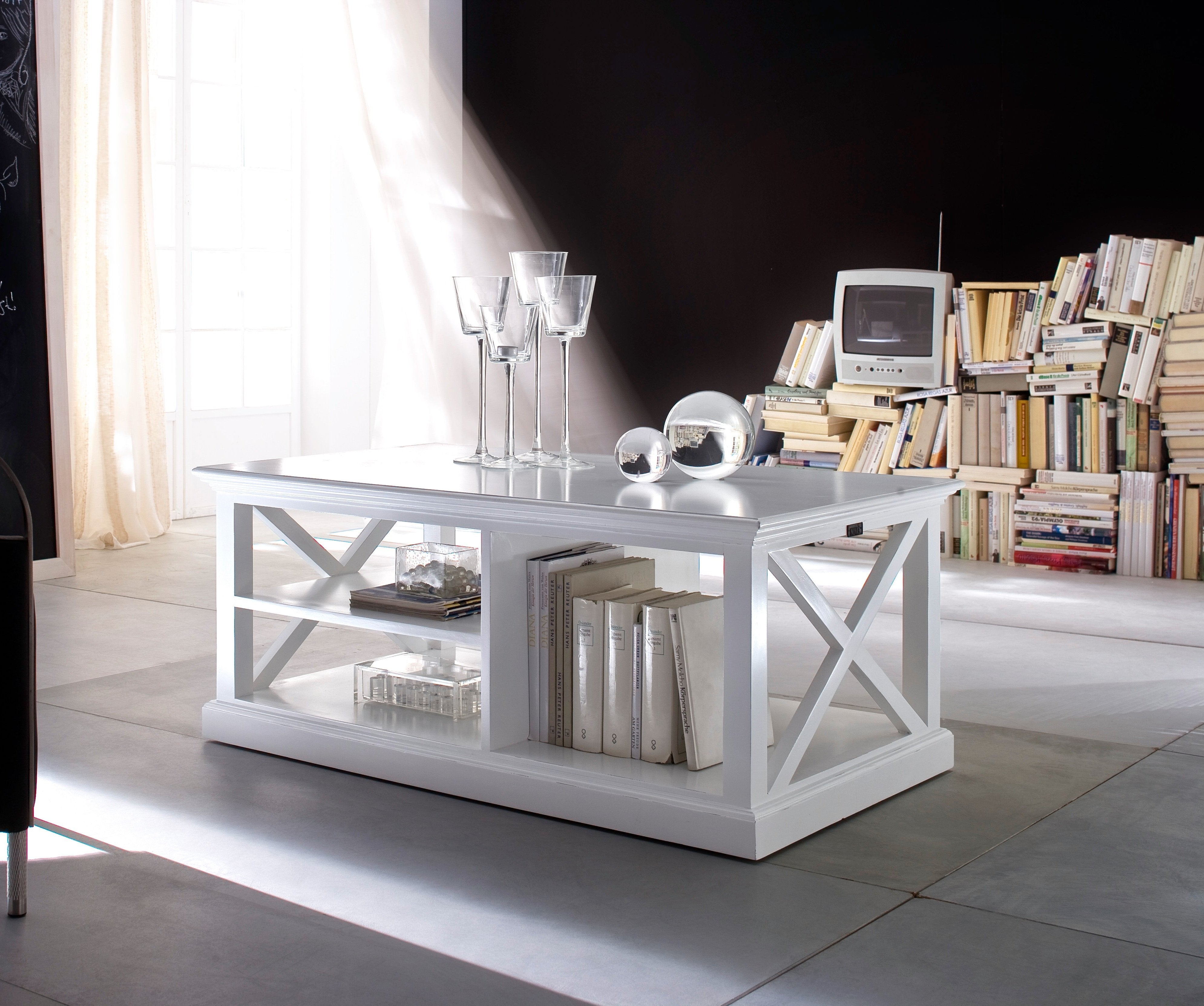 NovaSolo Halifax white wooden coffee table with 2 shelves and 1 adjacent storage area.