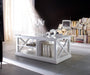 NovaSolo Halifax white wooden coffee table with 2 shelves and 1 adjacent storage area.