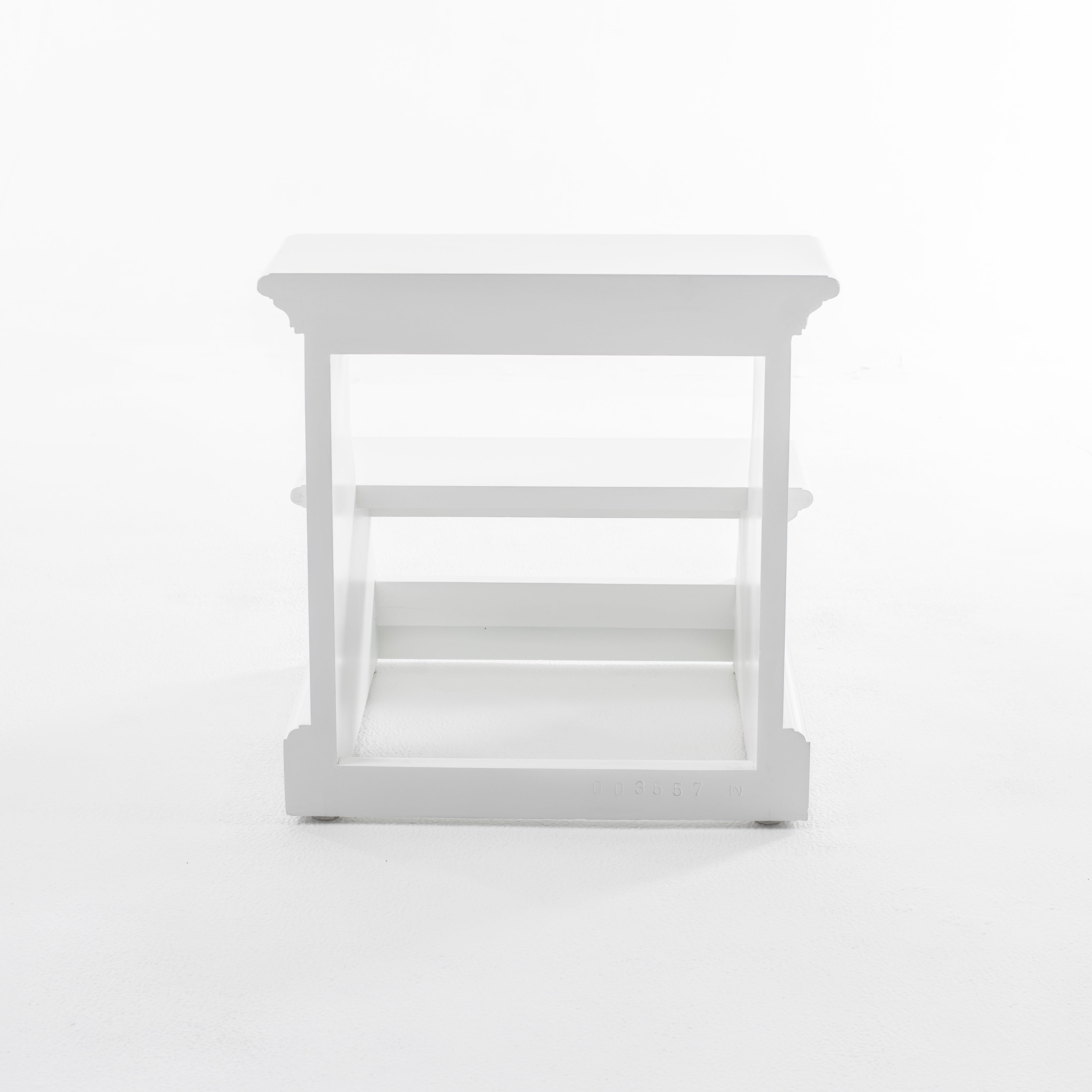 Rear view of a white timber bed step.