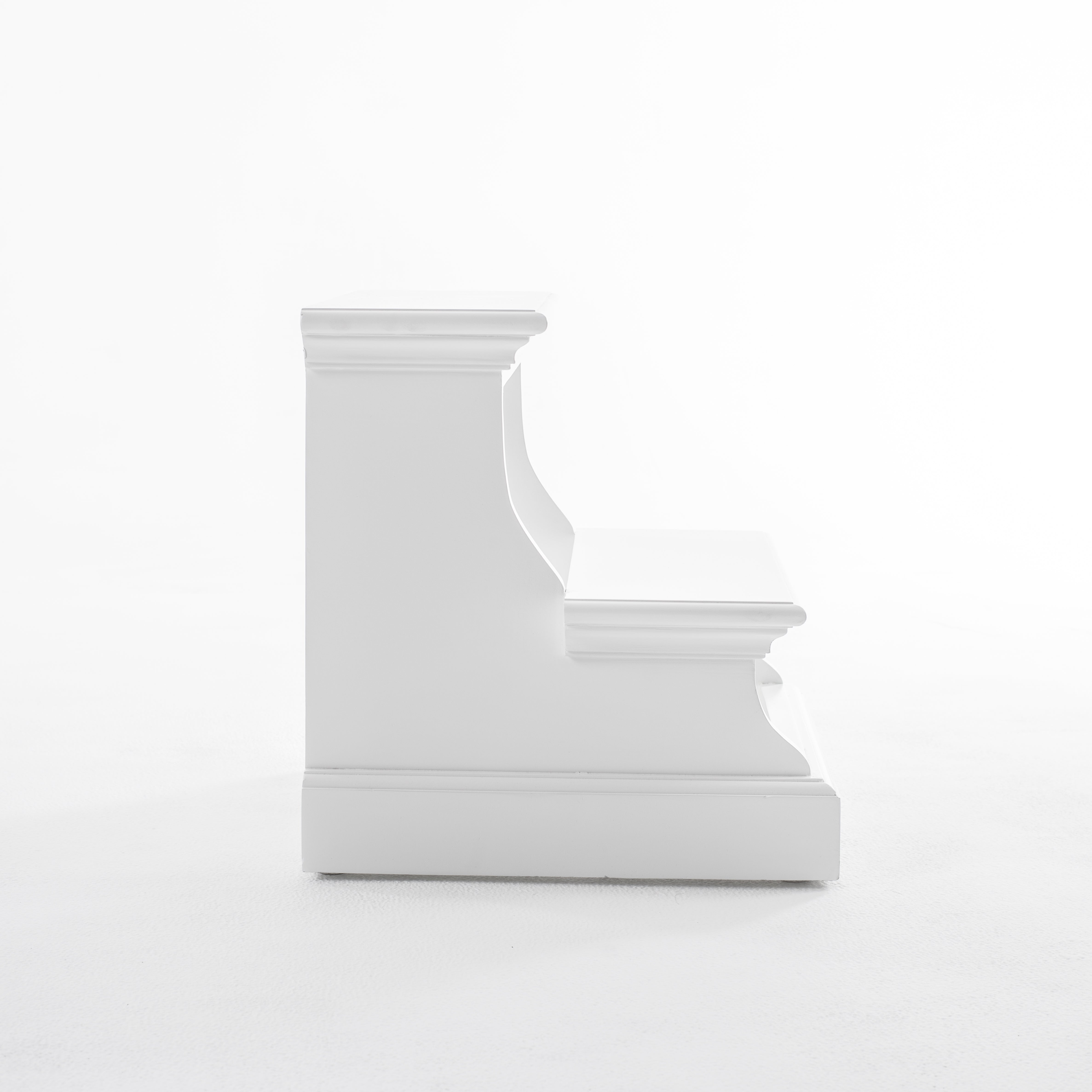 Side view of a white timber bed step.
