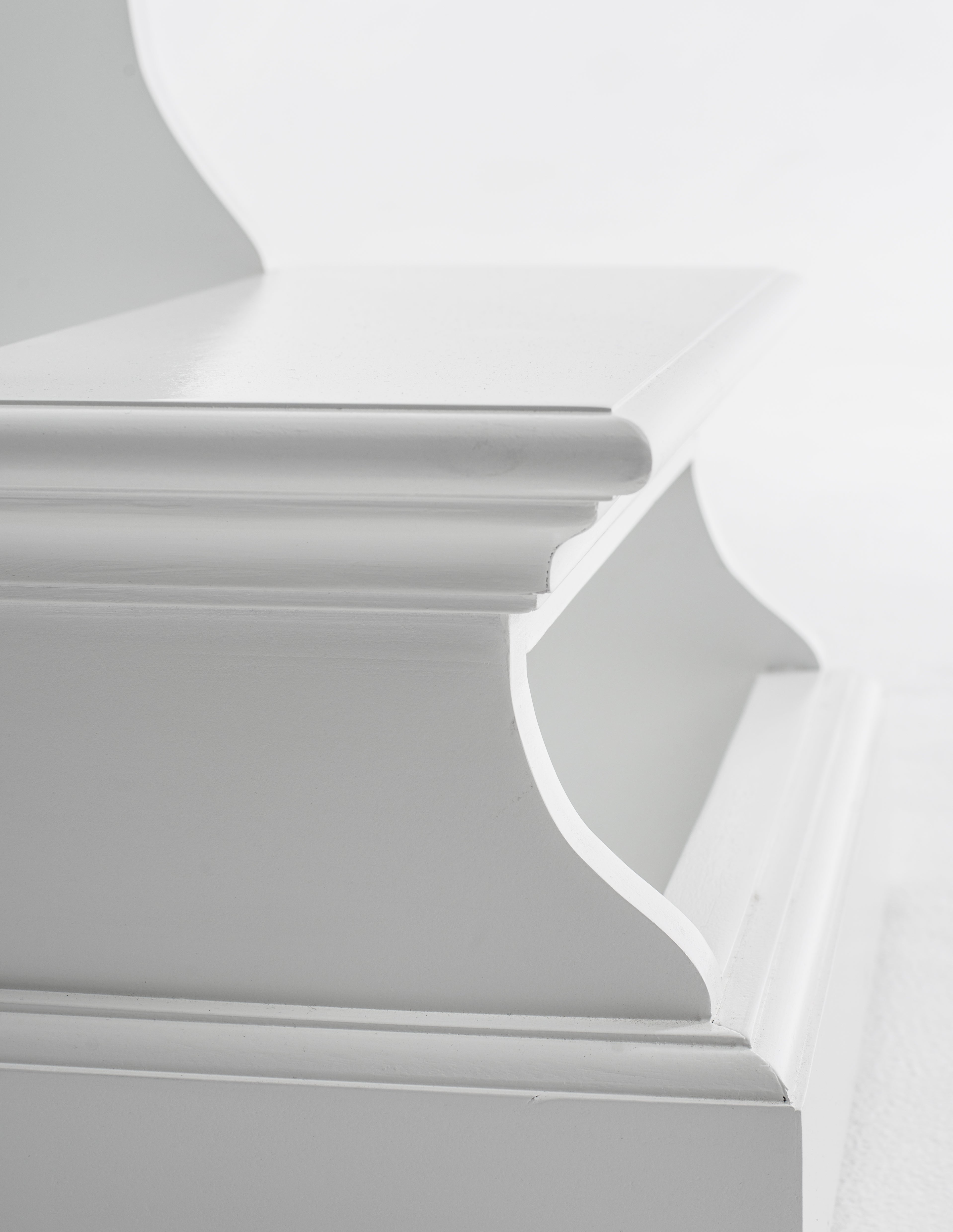 Close-up view of the bottom steps of a white timber bed step.