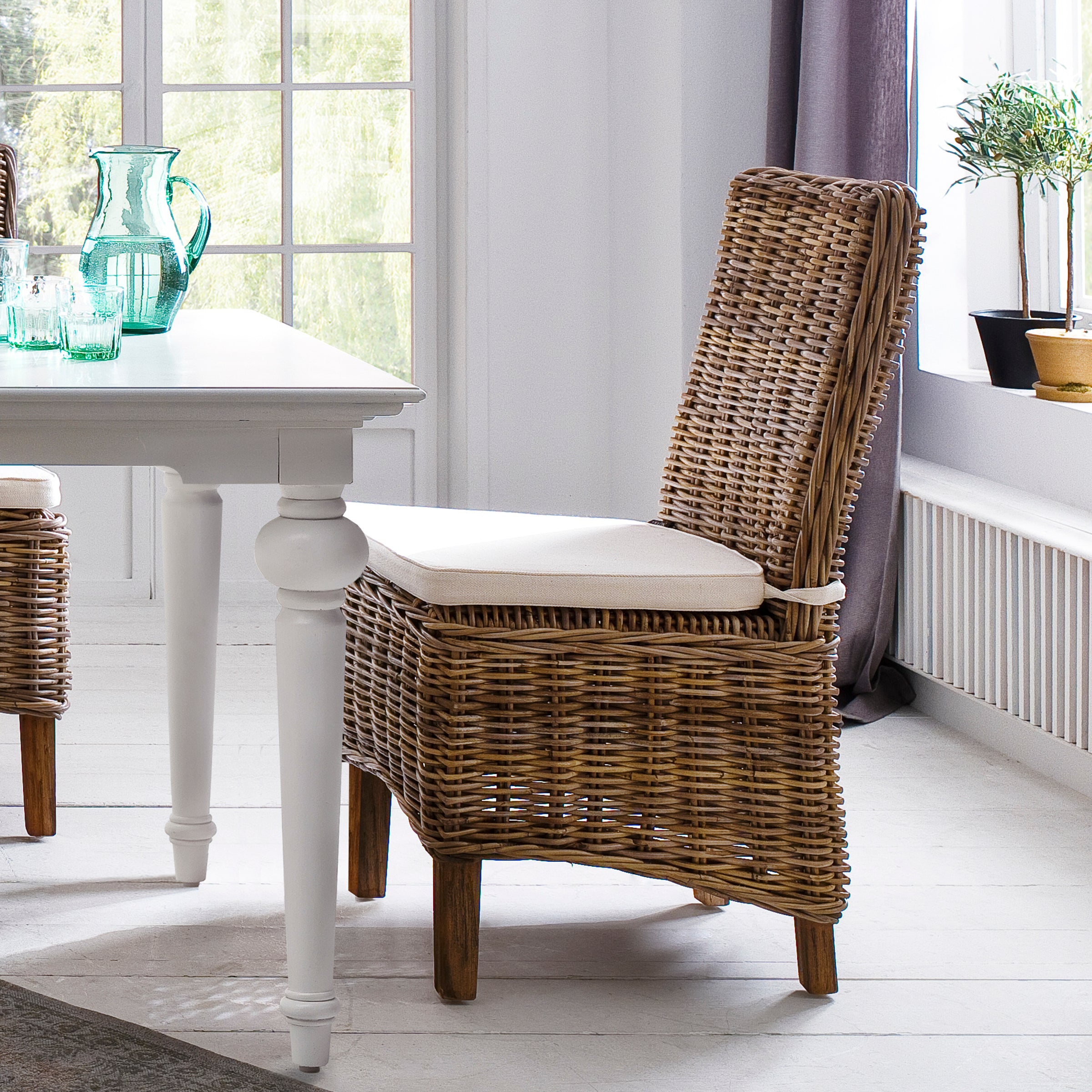 NovaSolo Wickerworks Morin dining chair with cushion (set of 2) made from kubu rattan and mahogany.