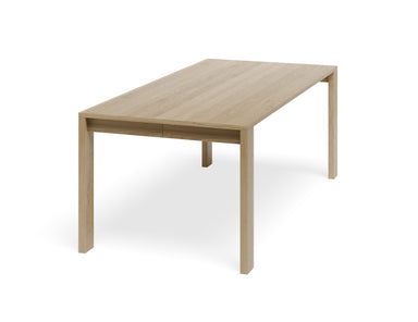 Angled view of Pier Dining Table - Solid Oak - 200 cm x 95 cm highlighting solid oak tabletop and square leg design.