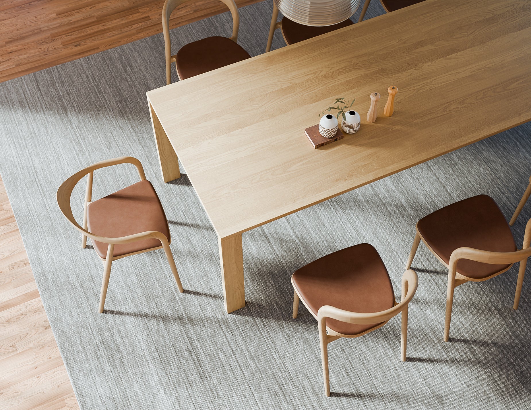 Overhead view of Pier Dining Table – Solid Oak – 240 cm x 100 cm styled with ceramic decor and matching timber dining chairs.