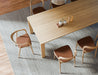 Overhead view of Pier Dining Table – Solid Oak – 240 cm x 100 cm styled with ceramic decor and matching timber dining chairs.