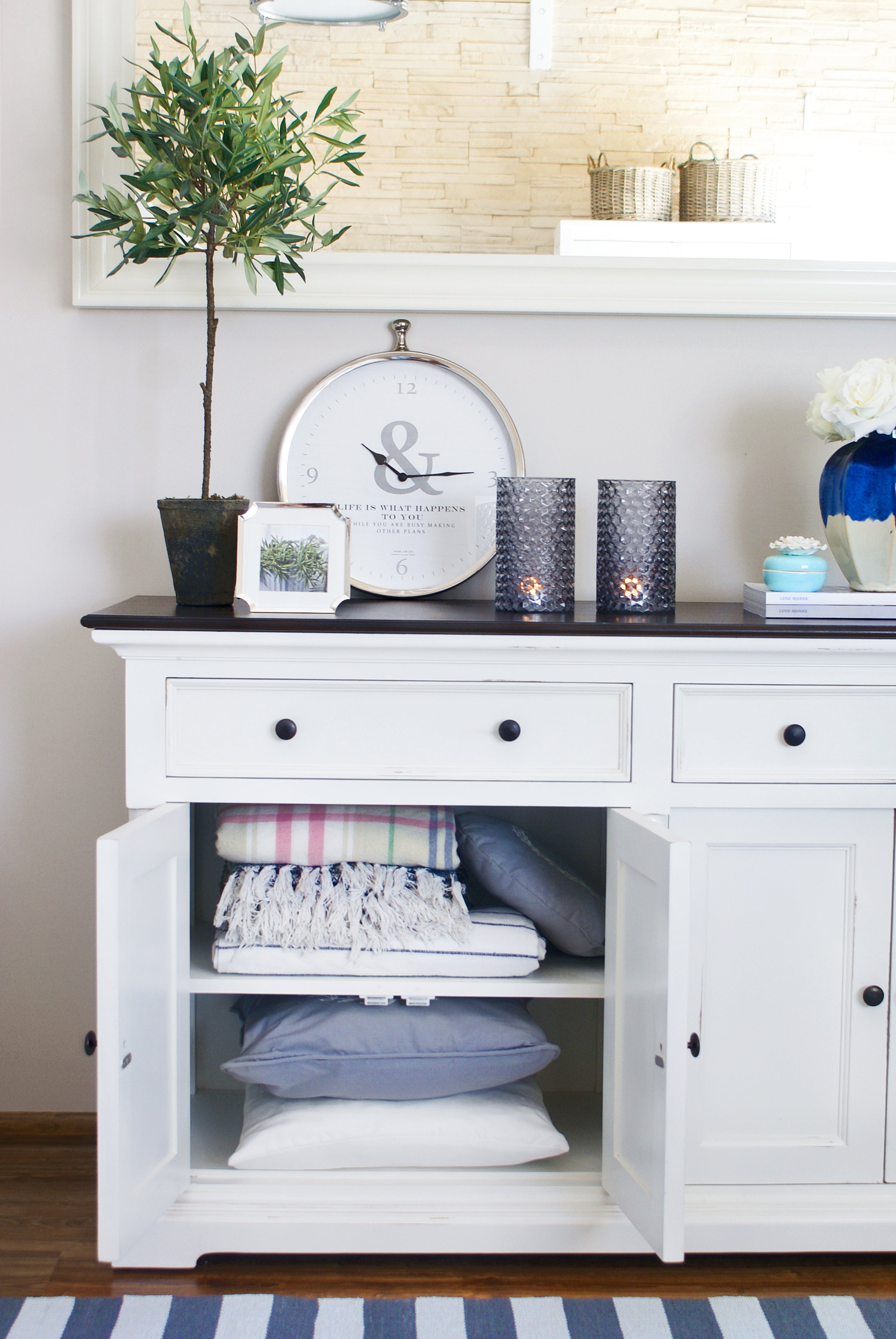 Close-up of the Provence Accent Classic Buffet with open cupboard doors showing shelves for cushions and throws.
