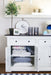 Close-up of the Provence Accent Classic Buffet with open cupboard doors showing shelves for cushions and throws.
