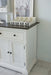 Close-up of the Provence Accent Classic Buffet showing a dark timber top, white painted side panel and styled storage tray.