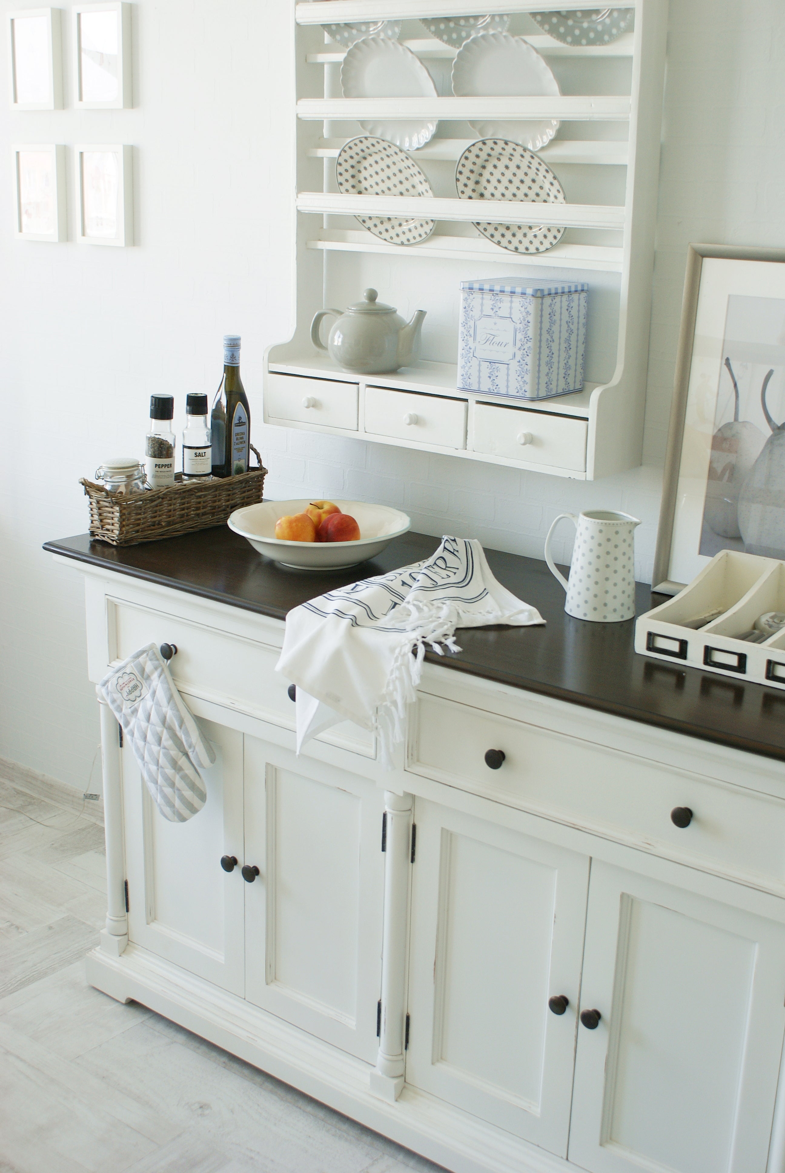 Close-up of the Provence Accent Classic Buffet with wall plate rack, dark timber top and styled kitchen accessories.