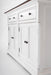 Angled close-up of the Provence Accent Classic Buffet showing white painted drawers, cupboard doors and dark round handles.