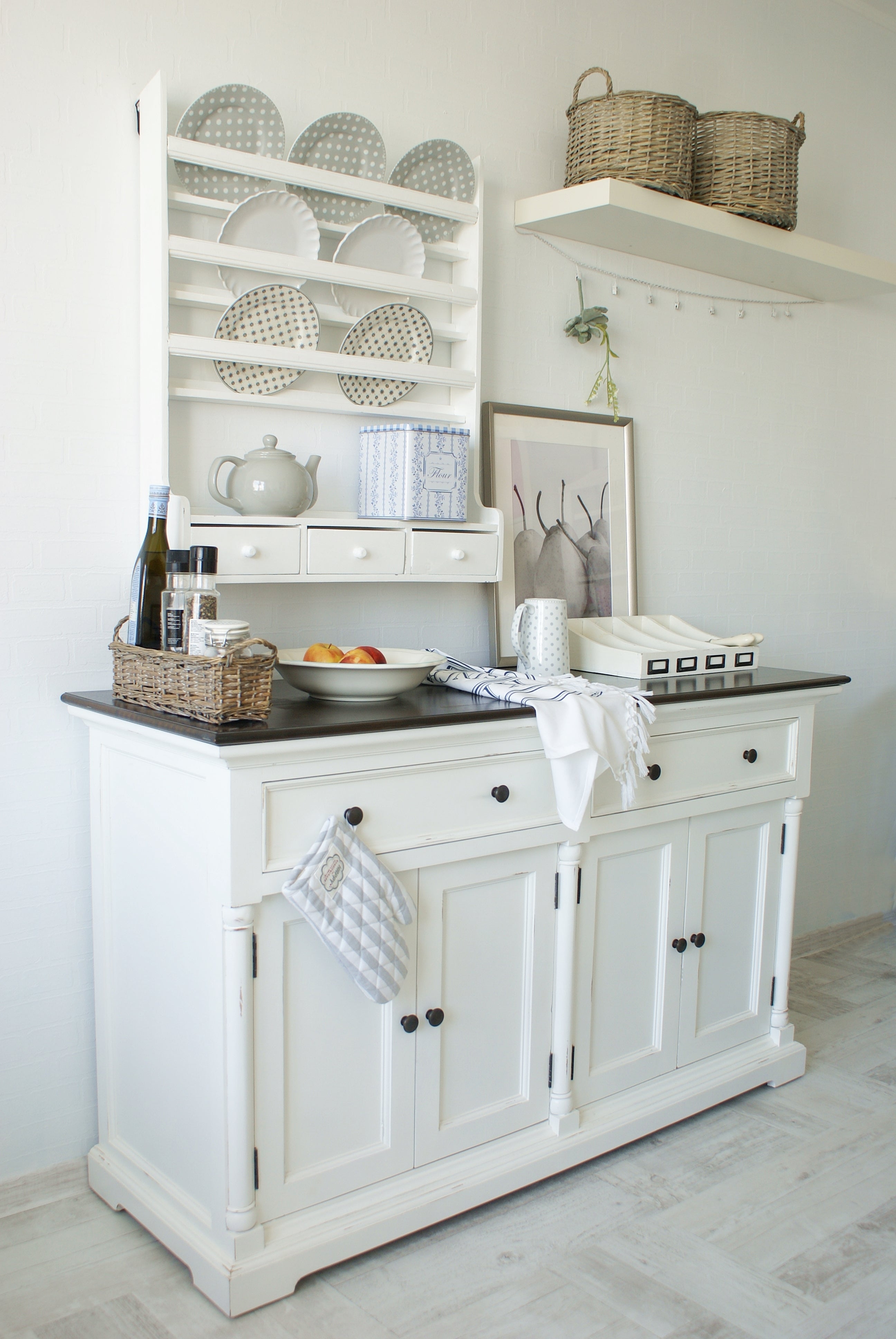Provence Accent Classic Buffet styled with a wall plate rack, baskets, crockery and kitchen accessories.
