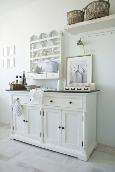 Provence Accent Classic Buffet styled in a light coastal kitchen with dark timber top, white painted base and matching wall plate rack.