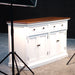 Provence Accent Classic Buffet photographed in a studio setting with dark timber top, white painted base and black hardware.