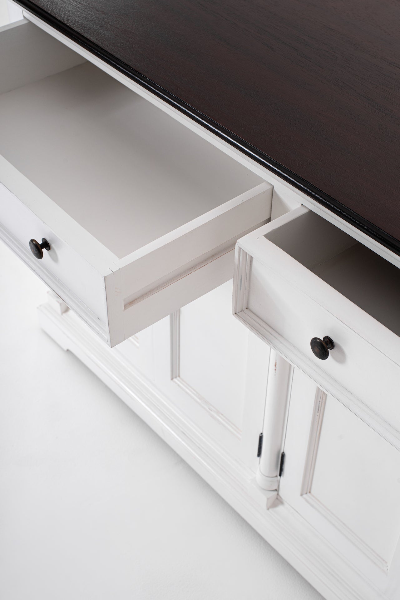 Close-up of open drawers on the Provence Accent Classic Buffet showing the dark timber top, white painted finish and black handles.