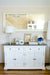 Front view of the Provence Accent Classic Buffet styled beneath a large mirror, featuring a dark timber top, white painted base, drawers and cupboard doors.