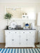 Front view of the Provence Accent Classic Buffet styled beneath a large mirror with decorative vases, candles and books.