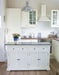 Provence Accent Classic Buffet styled as a kitchen island with white cabinetry, dark timber top and coastal kitchen decor.