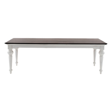 Front view of the Provence Accent Dining Table with a dark timber top, white painted base and traditional turned legs.