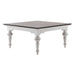 Angled product view of the Provence Accent Square Coffee Table featuring a dark timber top, white base and turned legs.