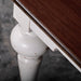 Close-up of the Provence Accent Square Coffee Table showing the dark timber top and white turned leg with a distressed finish.