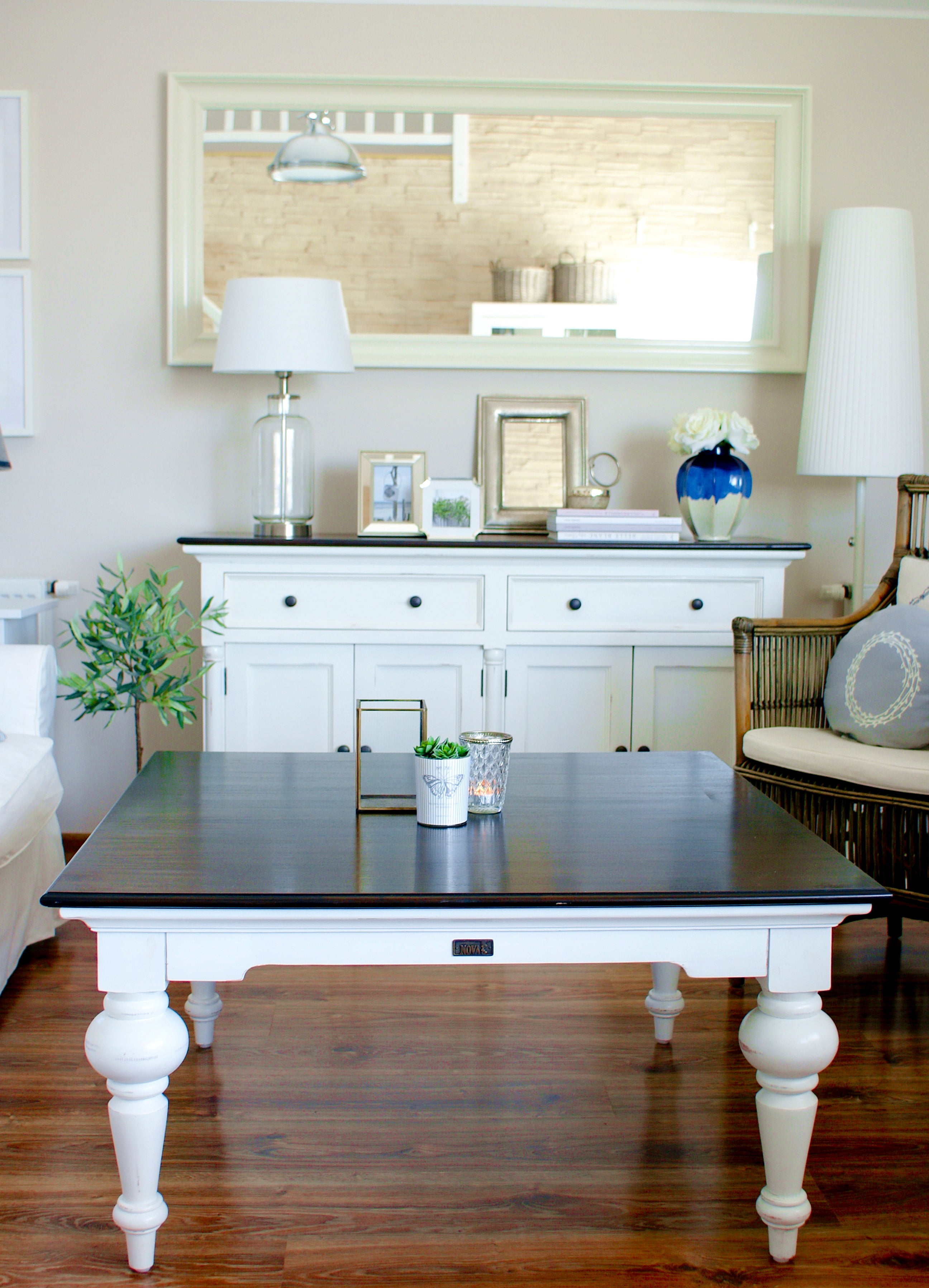 Provence Accent Square Coffee Table styled in a living room with a dark timber top, white base and classic coastal furniture setting.