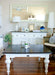 Provence Accent Square Coffee Table styled in a living room with a dark timber top, white base and classic coastal furniture setting.