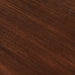 Close-up of the dark timber tabletop showing the rich brown wood grain and textured finish.