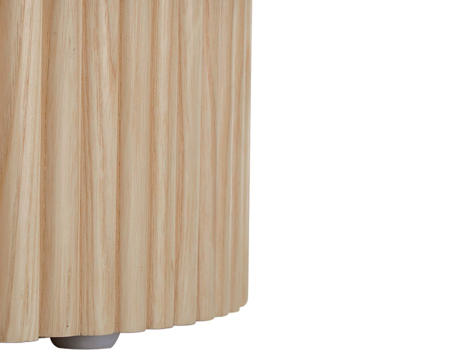Close-up view of ridges on round side table in natural ash colour.