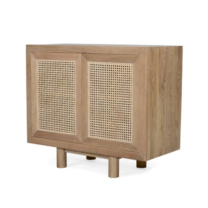 Three-quarter angled front view of Iluka Sideboard - Two Door in natural oak with rattan panels.