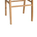 Close-up of the Zen Backless Bar Stool legs and footrest, showing the solid natural teak base construction.