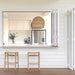 Pair of Zen Backless Bar Stools – Sand – Open Weave at a coastal-style servery window with white cladding.