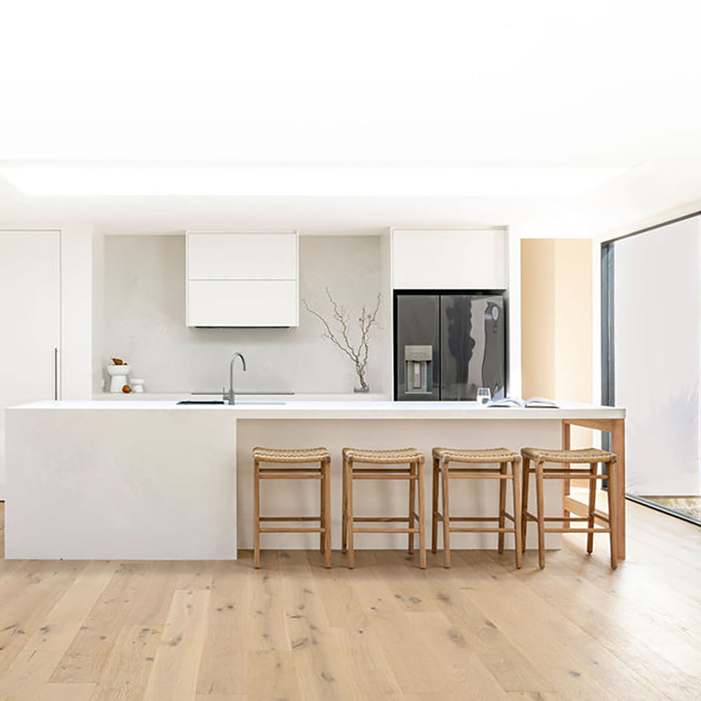 Wide-angle view of Zen Backless Bar Stools – Sand – Open Weave in a bright open-plan kitchen with timber flooring.