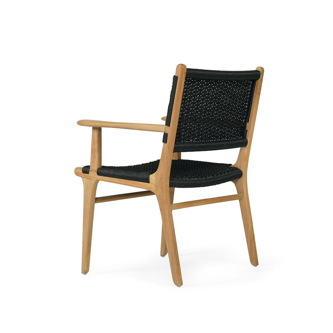 Angled back view of Zen Armchair – Black – Close Weave highlighting sculpted arms and tight weave detailing.