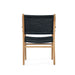Rear view of Zen Armchair – Black – Close Weave displaying the full backrest and contoured seat over a natural timber frame.