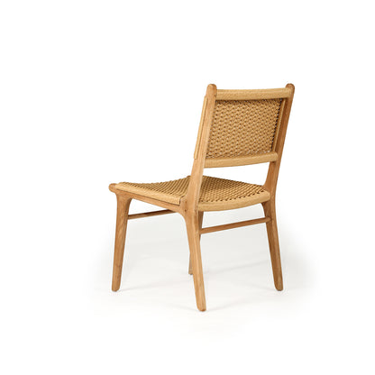 Angled rear-side view of the Zen Dining Chair – Sand – Close Weave highlighting the curve of the back legs and woven texture.