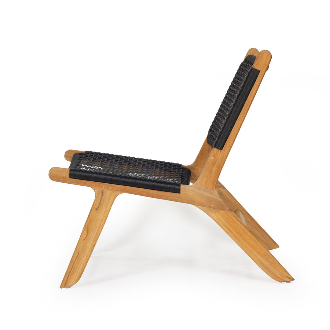 Side view of Zen Lazy Chair in Black with curved teak frame and open weave rope seat and backrest.