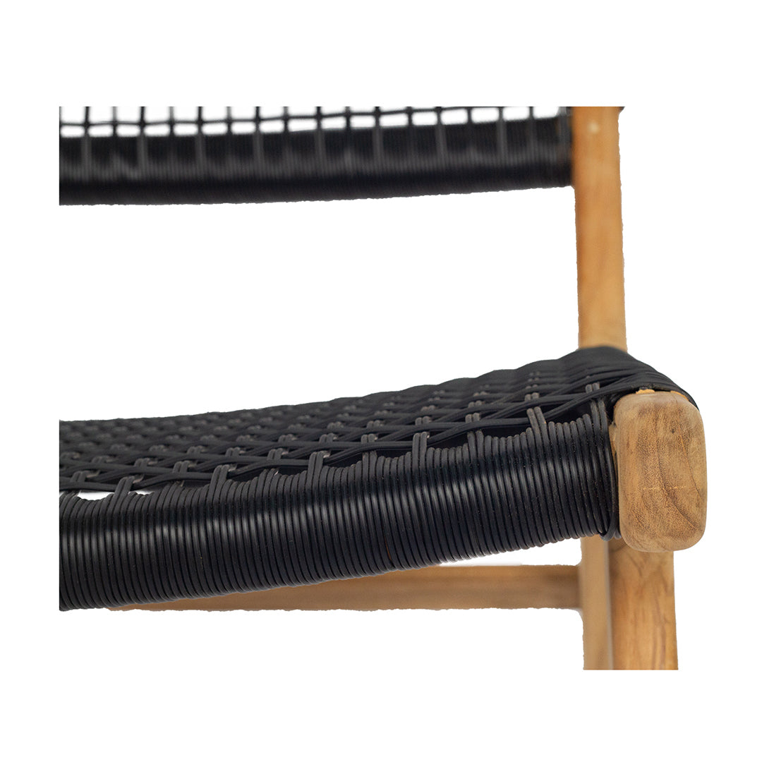 Close-up detail of Zen Lazy Chair showing tightly handwoven black rope seat and natural teak frame corner.